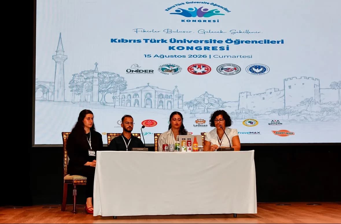 A panel on stage in front of the congress screen
